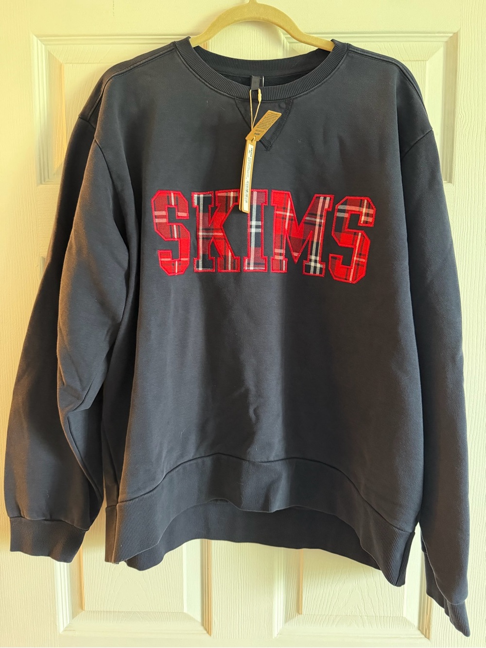 SKIMS Black Crewneck Sweatshirt with Red Plaid Logo